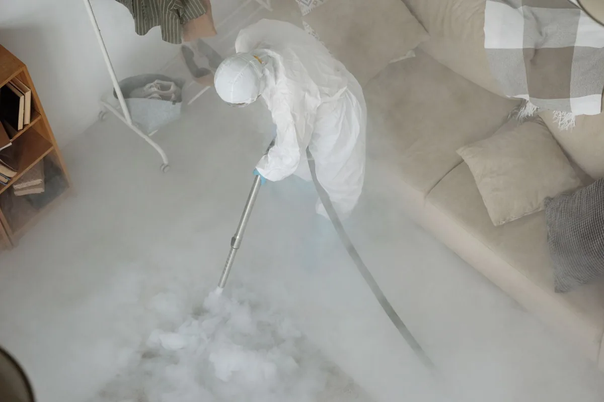 Biohazard cleanup technician in protective equipment, Chino, CA